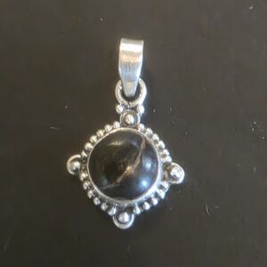 Elegant Silver Pendant with Black Stone